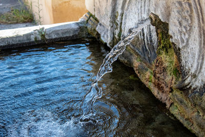 Close-up of water falling on rock