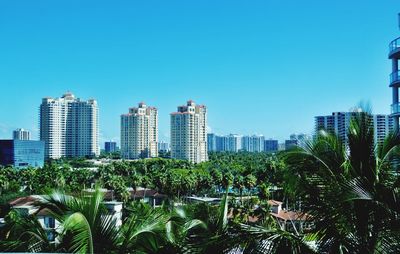 View of skyscrapers against blue sky