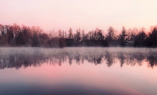 Scenic view of lake against sky during sunset