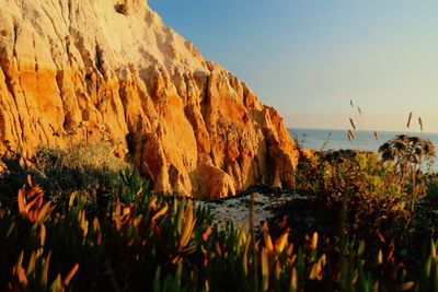 Scenic view of sea and rocks against sky