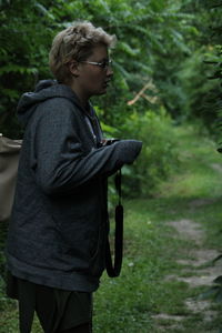 Side view of young woman looking away