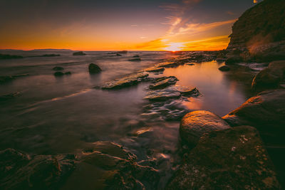 Scenic view of sea against sky during sunset