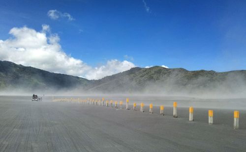 Scenic view of landscape against blue sky