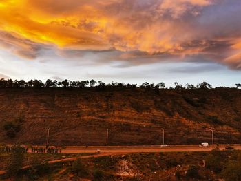 Scenic view of field against sky during sunset