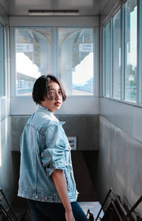 Man looking through train window