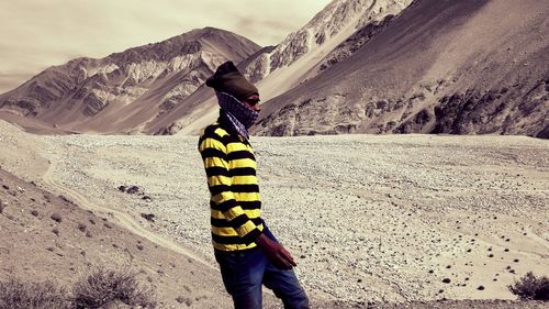 Full length of man standing on rock