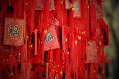 Close-up of luck equipment hanging in temple