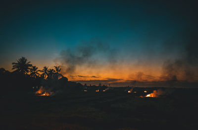 Scenic view of landscape against sky at night