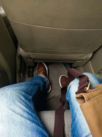 Low section of man wearing shoes