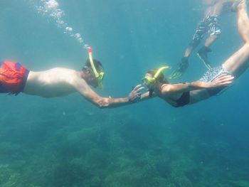 People swimming in sea