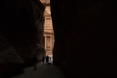 The two horizontal walls of the canyon give a glimpse of al-khazneh in petra early morning.