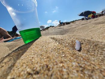 Surface level of beach against sky