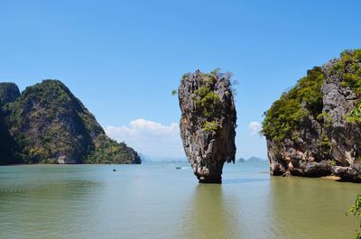 Stack rock in sea at james bond island against sky