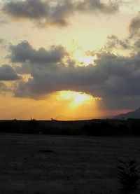 Scenic view of silhouette landscape against sky during sunset