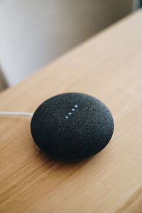 Close-up of modern speaker on table