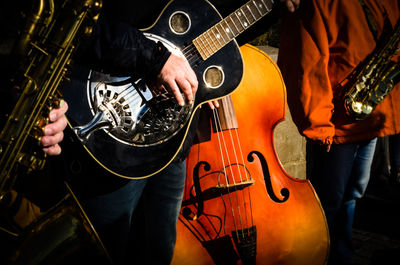 Man playing guitar at music concert