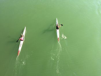 High angle view of men kayaking in river