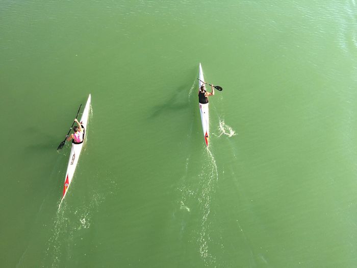 High angle view of men kayaking in river