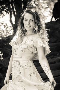Portrait of smiling woman standing outdoors