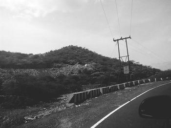 Country road leading towards mountains