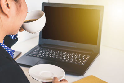 Low angle view of man working on table