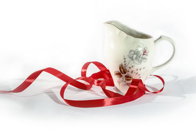 Close-up of heart shape over white background