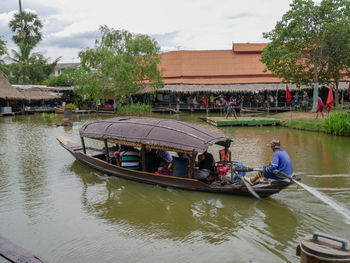 People on boat in river