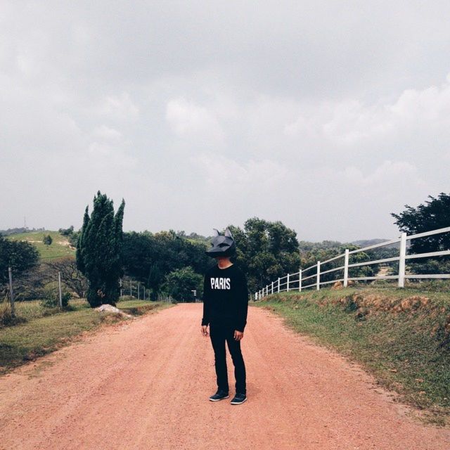 rear view, full length, the way forward, sky, lifestyles, walking, tree, casual clothing, men, transportation, cloud - sky, leisure activity, road, diminishing perspective, dirt road, vanishing point, standing, cloud