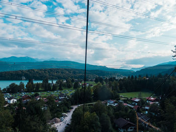High angle view of cityscape against cloudy sky