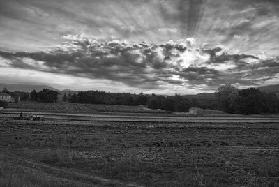 Scenic view of landscape against cloudy sky