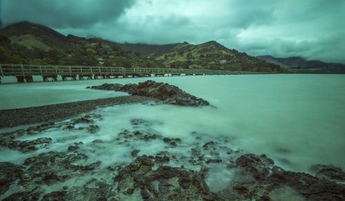 Scenic view of sea against cloudy sky