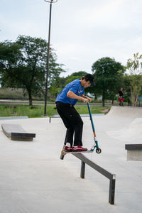 Boy skateboarding on skateboard