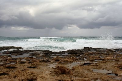 View of calm beach against the sky