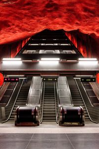 Empty illuminated escalators in subway station