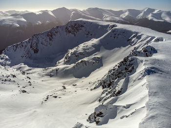 Scenic view of snow covered mountains