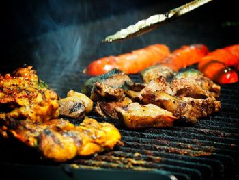 Close-up of meat on barbecue grill