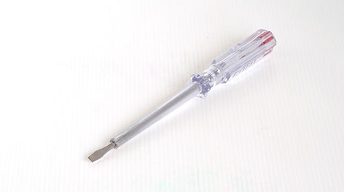 High angle view of pipes on table against white background