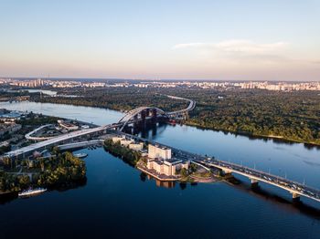 High angle view of bridge over river in city against sky