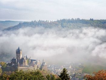 High angle view of church on mountain against sky