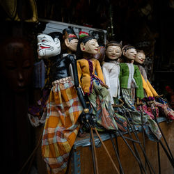 Wooden puppets for sale at market stall