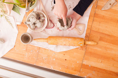 High angle view of person preparing food on table