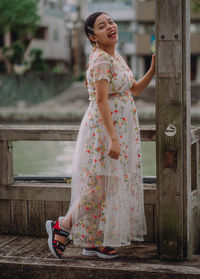 Full length of woman standing outdoors