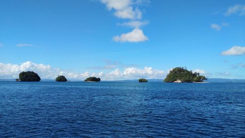 Scenic view of sea against blue sky