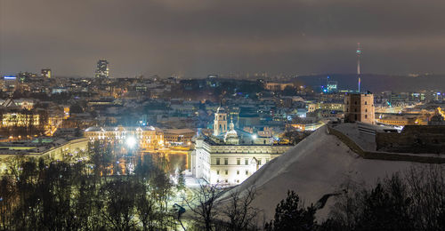 High angle view of illuminated buildings in city against sky