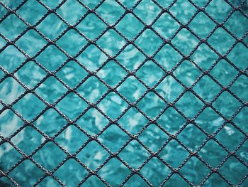 Full frame shot of fence over swimming pool