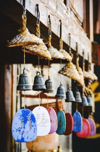 Close-up of decorations hanging in store for sale