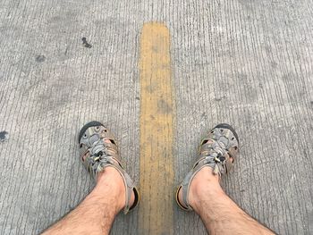 Low section of man standing on floor