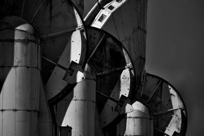 Low angle view of abandoned factory against sky