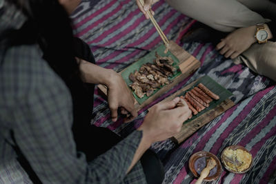 High angle view of people holding food