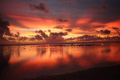 Scenic view of sea against romantic sky at sunset